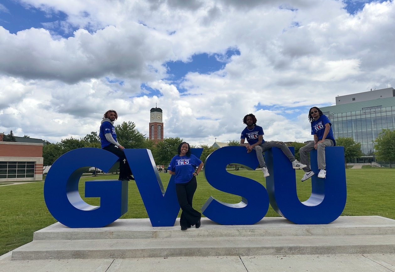 GVSU UBMS Summer Tutor Counselors in Front of GVSU Sign in Allendale